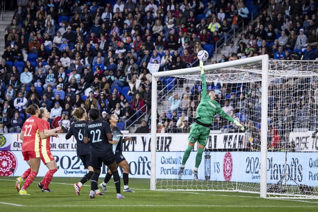 Ann-Katrin Berger #30 of NJ/NY Gotham FC jumps and stops the shot on goal in the first half of the 2024 National Women&#39;s Soccer League Playoff match against Portland Thorns FC at Red Bull Arena on November 10, 2024 in Harrison, New Jersey.