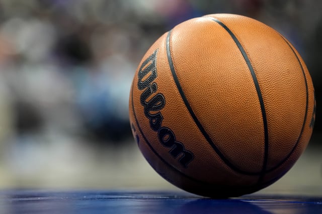 DETROIT, MICHIGAN - MARCH 15: A detailed view of a Wilson brand official NBA game ball basketball on the court during the game between the Detroit Pistons and Oklahoma City Thunder at Little Caesars Arena on March 15, 2025 in Detroit, Michigan.