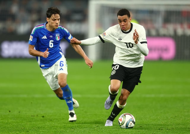 Soccer Football - Nations League - Quarter Final - Second Leg - Germany v Italy - Signal Iduna Park, Dortmund, Germany - March 23, 2025 Germany's Jamal Musiala in action with Italy's Samuele Ricci REUTERS/Leon Kuegeler