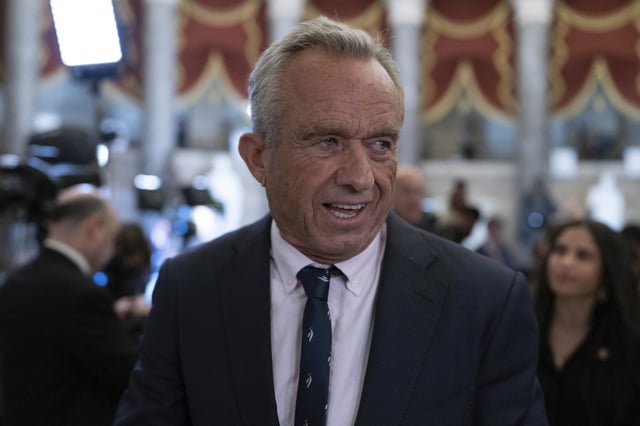 Secretary of Health and Human Services Robert F. Kennedy Jr. walks to the House Chamber before President Donald Trump addresses to a joint session of Congress at the Capitol in Washington, Tuesday, March 4, 2025. (AP Photo/Jose Luis Magana)