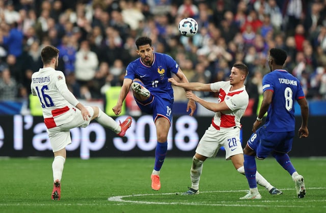 Soccer Football - Nations League - Quarter Final - Second Leg - France v Croatia - Stade de France, Saint-Denis, France - March 23, 2025 France's William Saliba and Aurelien Tchouameni in action with Croatia's Martin Baturina and Franjo Ivanovic REUTERS/Sarah Meyssonnier