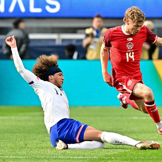 USA's defender #17 Marlon Joseph Fossey slides into Canada's forward #14 Jacob Shaffelburg during the CONCACAF Nations League third place final football match between USA and Canada at SoFi Stadium in Inglewood, California, on March 23, 2025. (Photo by Frederic J. Brown / AFP) (Photo by FREDERIC J. BROWN/AFP via Getty Images)