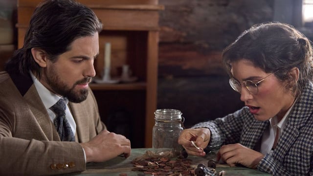 Lucas and Edie sort through coins in When Calls the Heart