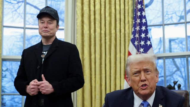 US President Donald Trump speaks next to Elon Musk and X Æ A-12, Musk's son, in the Oval Office of the White House in Washington.