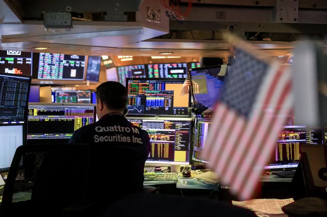 A trader works on the floor of the New York Stock Exchange (NYSE) in New York, US, on Wednesday, March 19, 2025. Federal Reserve officials held their benchmark interest rate steady for a second straight meeting, though they telegraphed expectations for slower economic growth and higher inflation. Photographer: Michael Nagle/Bloomberg via Getty Images