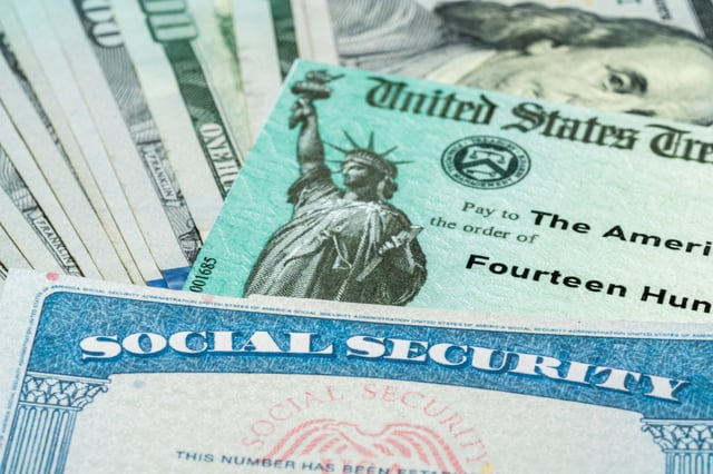 Stock image/file photo: A Social Security card with a Treasury Department check and U.S. Dollars.