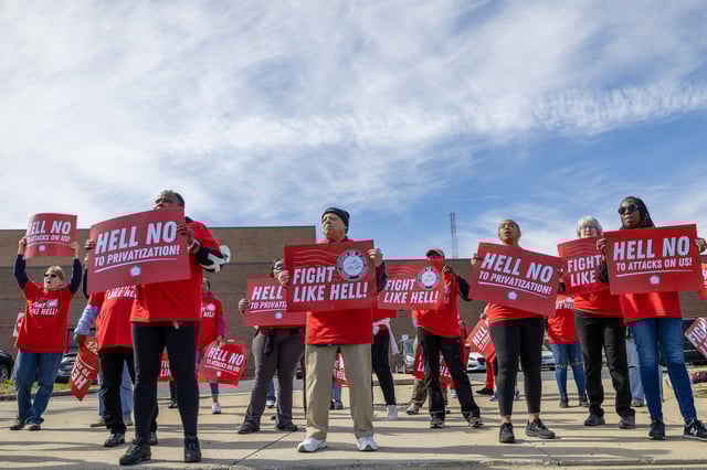 Members of the National Association of Letter Carriers and protesters gather at the United States Post Office in Washington, DC on March 23, 2025 in Washington, DC.