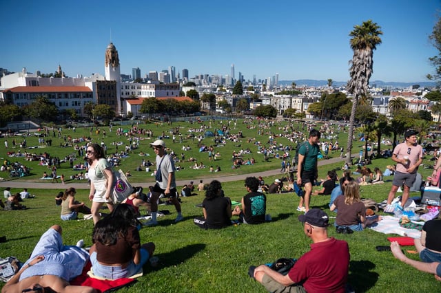 Crowds gather at Dolores Park during a summer heat wave in San Francisco in July 2023. Temperatures are expected to soar to the upper 70s to low 80s in San Francisco’s Mission District on Monday and Tuesday.