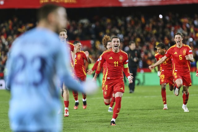 Spanish players celebrate after reaching the semifinals via a penalty shootout.