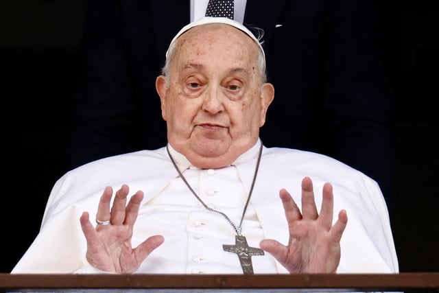 Pope Francis gestures during his first public appearance in five weeks, on the day of his discharge from Gemelli Hospital, in Rome, Italy, March 23, 2025. REUTERS/Yara Nardi