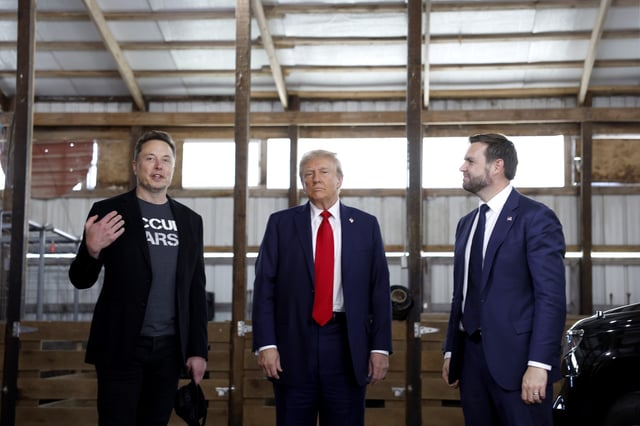 Elon Musk President Donald Trump and Vice President Sen. JD Vance talk to reporters back stage during a campaign rally at the Butler Farm Show grounds on October 05, 2024 in Butler, Pennsylvania