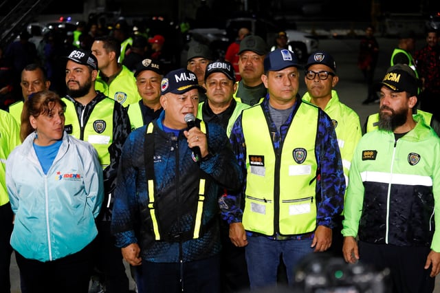 Venezuela's Interior Minister Diosdado Cabello speaks using a microphone, on the day Venezuelan migrants arrive on a flight after being deported from the United States, in Caracas, Venezuela, March 24, 2025. REUTERS/Leonardo Fernandez Viloria
