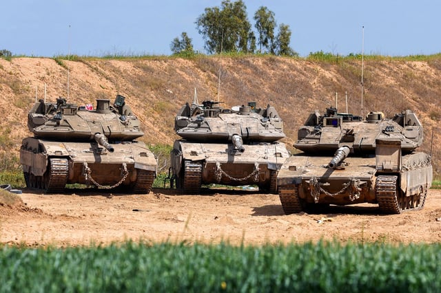 Israeli tanks are seen near the northern Gaza Strip on March 19.