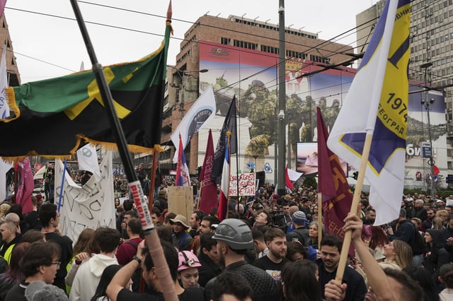 People take part in a protest rally in Belgrade, Serbia, Monday, March 24, 2025, against a real estate development project that will be financed by the firm of Donald Trump's son-in-law, Jared Kushner, at the site of the former Yugoslav army headquarters destroyed in a U.S.-led NATO bombing campaign in 1999. (AP Photo/Darko Vojinovic)