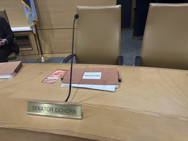 The chair for Minnesota state Sen. Justin Eichorn, a Republican from Grand Rapids, sits empty in a Senate hearing room in the State Capitol complex in St. Paul on Tuesday, March 18, 2025, a day after his arrest in Bloomington for allegedly soliciting a minor for prostitution. (AP Photo/Steve Karnowski)