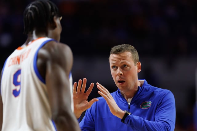 Feb 18, 2025; Gainesville, Florida, USA; Florida Gators assistant coach Kevin Hovde talks with Florida Gators center Rueben Chinyelu (9) after a timeout against the Oklahoma Sooners during the first half at Exactech Arena at the Stephen C. O'Connell Center. Mandatory Credit: Matt Pendleton-Imagn Images/File Photo