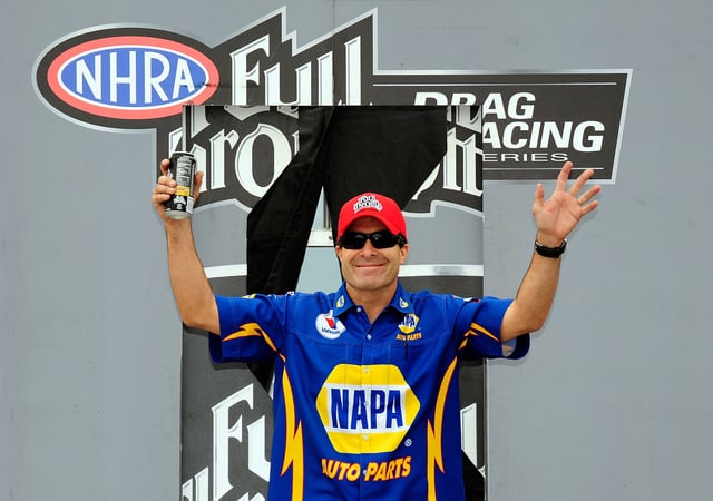 Ron Capps, driver of the NAPA funny car waves to the fans during the NHRA Carolinas Nationals on September 20, 2009 at Zmax Dragway in Concord, North Carolina.
