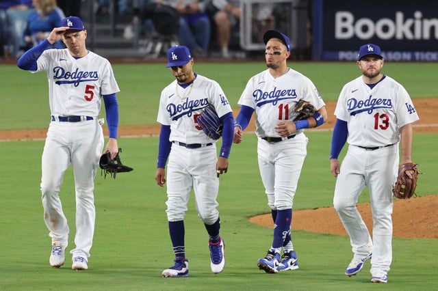 LOS ANGELES, CALIFORNIA - OCTOBER 09: Freddie Freeman #5, Mookie Betts #50, Miguel Rojas #11, and Max Muncy #13 of the Los Angeles Dodgers are seen during the fourth inning against the Arizona Diamondbacks in Game Two of the Division Series at Dodger Stadium on October 09, 2023 in Los Angeles, California.