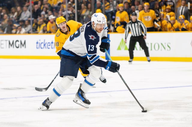 Nov 23, 2024; Nashville, Tennessee, USA;  Winnipeg Jets center Gabriel Vilardi (13) skates with the puck against against the Nashville Predators during the second period at Bridgestone Arena. Mandatory Credit: Steve Roberts-Imagn Images/File Photo