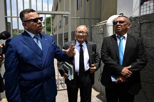 Lawyer Jaime Ortega (L) and colleagues filed a habeas corpus writ in El Salvador for the liberation of the Venezuelans