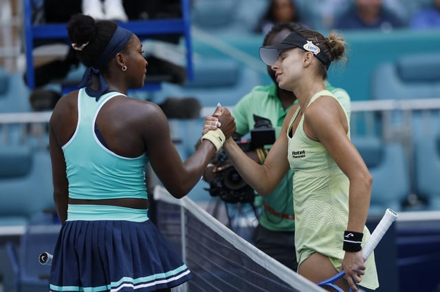 Mar 24, 2025; Miami, FL, USA; Magna Linette (POL)(R) shakes hands with Coco Gauff (USA)(L) at the net after their match on day seven of the Miami Open at Hard Rock Stadium. Mandatory Credit: Geoff Burke-Imagn Images