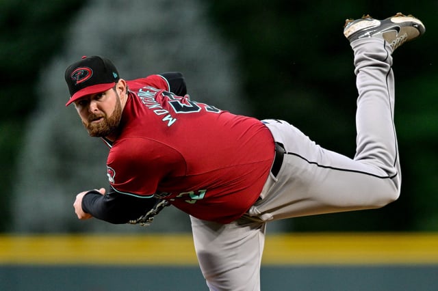 DENVER, COLORADO - SEPTEMBER 17: Jordan Montgomery #52 of the Arizona Diamondbacks pitches in the first inning against the Arizona Diamondbacks at Coors Field on September 17, 2024 in Denver, Colorado.