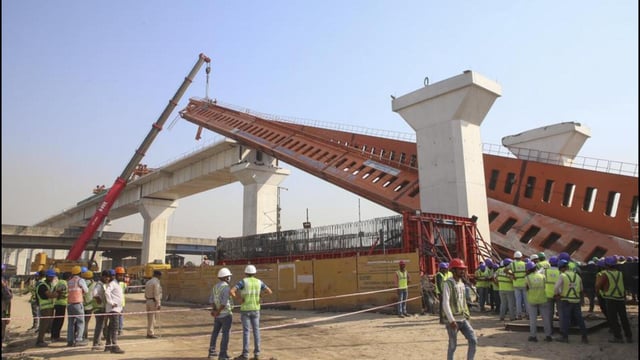 Ahmedabad: Restoration work underway after a segmental launching gantry (crane), which lifts and places segments of the elevated viaduct for the ongoing construction of the Ahmedabad-Mumbai bullet train project, skidded and fell near Vatva-Ropda Road, in Ahmedabad, Monday, March 24, 2025. The incident took place late Sunday night. (PTI Photo) (PTI03_24_2025_000077A) (PTI)