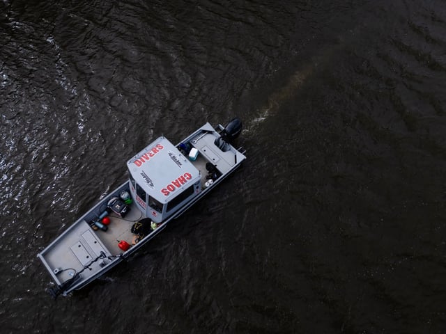 Members of the Elgin Police Department and the nonprofit organization, Chaos Divers, use sonography to search for Karen Schepers and her vehicle in the Fox River on March 24, 2025, in Elgin. The Elgin woman has been missing since 1983. (Stacey Wescott/Chicago Tribune)
