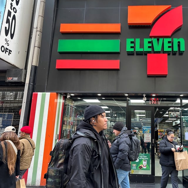 People shop at a 7-Eleven convenience store in New York, March 19, 2024.