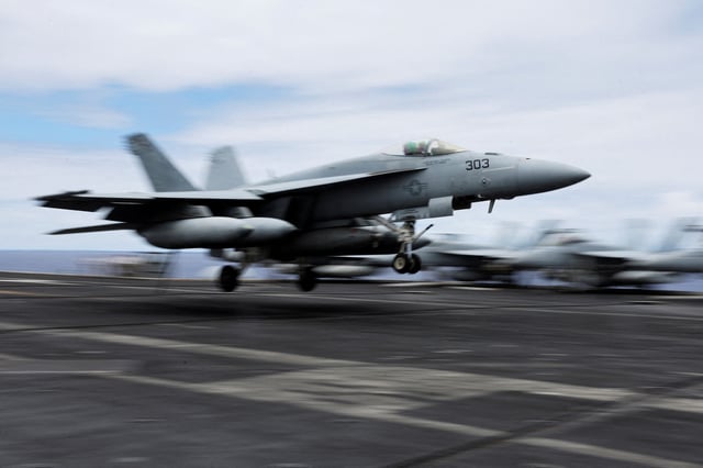 A F-18 jet lands on the runway of the USS Carl Vinson aircraft carrier during the Rim of the Pacific (RIMPAC) military exercises about 100 miles south of Oahu, Hawaii, U.S. July 19, 2024.  REUTERS/Marco Garcia/File Photo