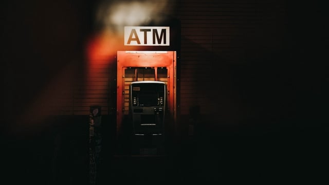 ATM interchange fees refer to the amount one bank pays to another when a customer uses a different bank's ATM to withdraw money.