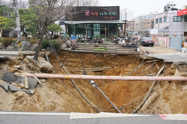 A massive sinkhole in Seoul, South Korea on Tuesday.