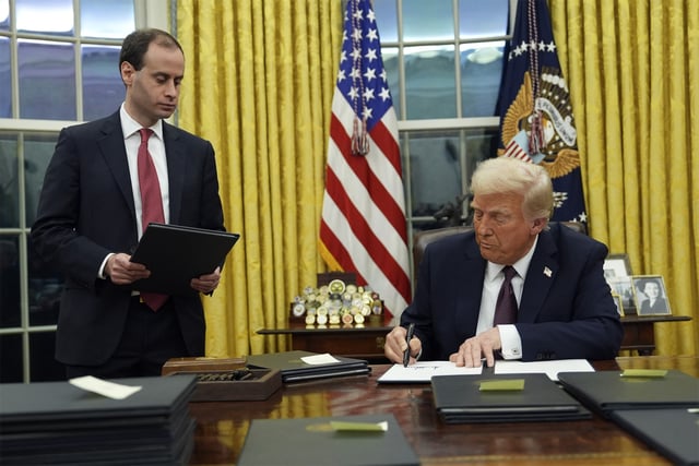 President Donald Trump signs an executive order on TikTok in the Oval Office of the White House, Monday, Jan. 20, 2025, in Washington.