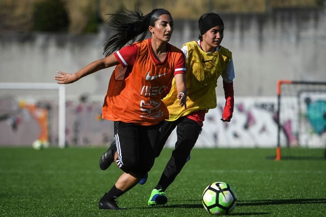Players of Afghanistan national women football team attend to a training session at Odivelas, outskirts of Lisbon on September 30, 2021. - Forced to flee Afghanistan after the Taliban came to power, players of the women's national football team and their families were welcomed to Portugal where they were able to train again today in a suburban stadium of Lisbon. (Photo by PATRICIA DE MELO MOREIRA / AFP) (Photo by PATRICIA DE MELO MOREIRA/AFP via Getty Images)