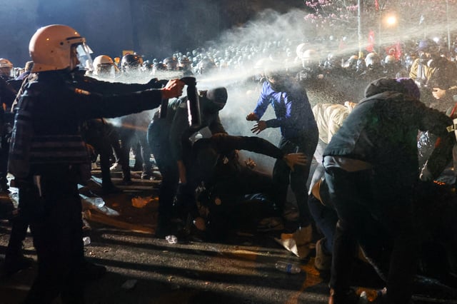 Men help demonstrators as police officers use pepper spray during a protest against the arrest of Istanbul Mayor Ekrem Imamoglu as part of a corruption investigation, in Istanbul, Turkey, March 24, 2025. REUTERS/Murad Sezer