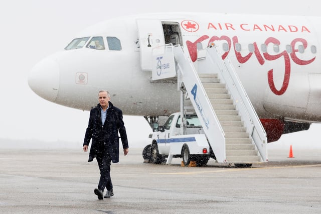 Canada's Prime Minister Mark Carney walks across the tarmac, on day two of his Liberal Party election campaign tour, at Gander International Airport in Gander, Newfoundland, Canada March 24, 2025. REUTERS/Blair Gable/File Photo