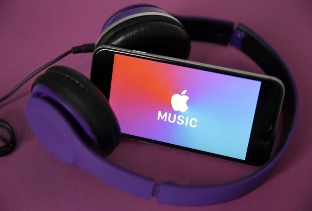 PARIS, FRANCE - APRIL 08: In this photo illustration, the logo of the music streaming platform Apple Music is displayed on the screen of an iPhone on April 08, 2019 in Paris, France. The number of paying subscribers to the music streaming service of Apple Music has for the first time exceeded that of Spotify customers in the US. The two platforms now have 28 and 26 million paying users, respectively, sources told the Wall Street Journal. (Photo by Chesnot/Getty Images)