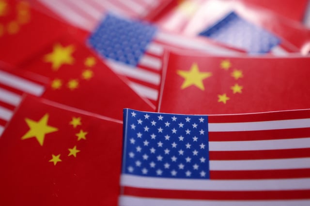 U.S. and Chinese flags are seen in this illustration taken March 20, 2025. REUTERS/Dado Ruvic/Illustration/File Photo