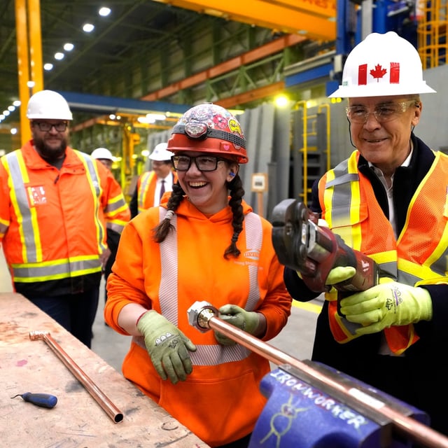 Liberal Leader Mark Carney meets workers as he tours the Irving Shipbuilding facility in Halifax on Tuesday, March 25, 2025. THE CANADIAN PRESS/Frank Gunn
