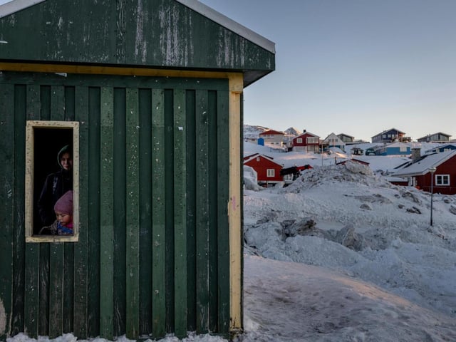 FILE — A young Inuit girl and her mother wait inside a bus shelter in Nuuk, Greenland, Jan. 13, 2025. President Trump’s plans to send representatives to Greenland this week have angered political leaders on the island territory, who see the group’s visit as an aggressive escalation of his threats to seize the area, by force if necessary. (Ivor Prickett/The New York Times)