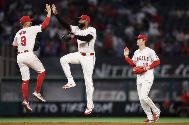 Zach Neto #9, Jo Adell #7, and Mickey Moniak #16 of the Los Angeles Angels celebrate their win over the Los Angeles Dodgers at Angel Stadium of Anaheim on September 04, 2024 in Anaheim, California.
