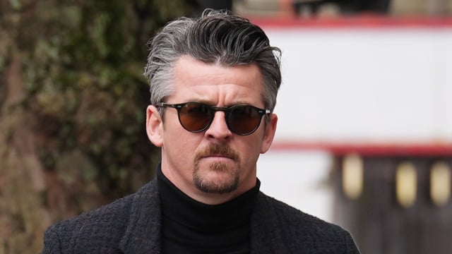 Barton grabbed his wife and pushed her to the ground before kicking her in the head during a row at their home