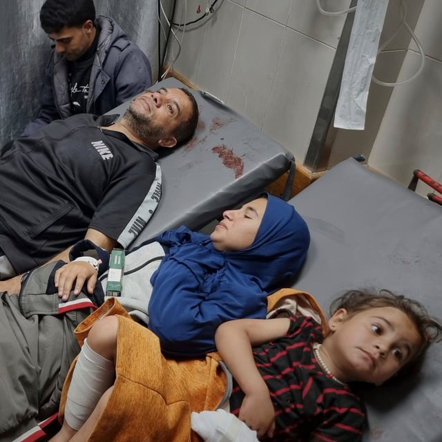 Injured Palestinians wait for treatment at the hospital following Israeli army airstrikes in Khan Younis, southern Gaza Strip, Tuesday, March 18, 2025. (AP Photo/Mohammad Jahjouh)