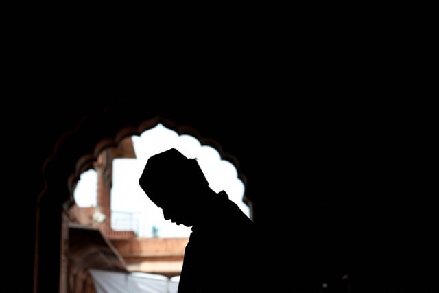 A Muslim man offers prayers during Jumat-ul-Vida, or the last Friday of the holy fasting month of Ramadan, inside Jama Masjid (Grand Mosque) in the old quarters of Delhi, India, April 5, 2024. REUTERS/Priyanshu Singh/File photo