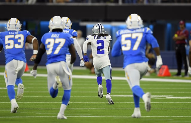 KaVontae Turpin #2 of the Dallas Cowboys returns a kick off for a 100 yard touchdown against Los Angeles Chargers during the first half at SoFi Stadium on August 20, 2022.
