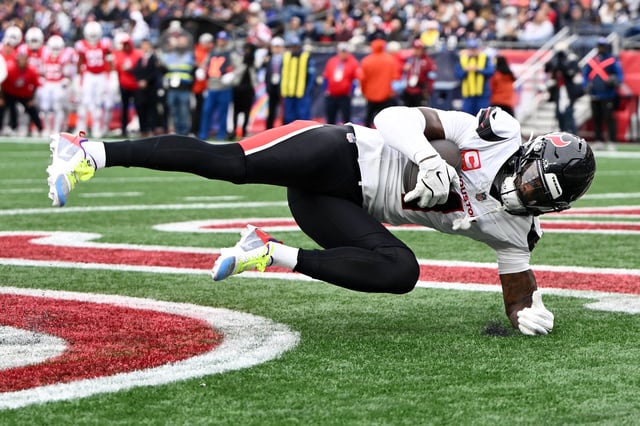Oct 13, 2024; Foxborough, Massachusetts, USA; Houston Texans wide receiver Stefon Diggs (1) makes a catch for a touchdown against the New England Patriots during the second half at Gillette Stadium. Mandatory Credit: Brian Fluharty-Imagn Images/File Photo