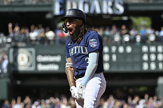 SEATTLE, WASHINGTON - AUGUST 30: J.P. Crawford #3 of the Seattle Mariners reacts to scoring two runs on a single during the seventh inning against the Oakland Athletics at T-Mobile Park on August 30, 2023 in Seattle, Washington.