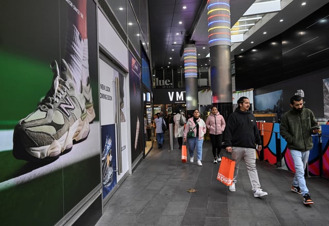 Shoppers walk out of a mall in Sydney's CBD in Sydney, Australia, July 3, 2024. REUTERS/Jaimi Joy/File Photo