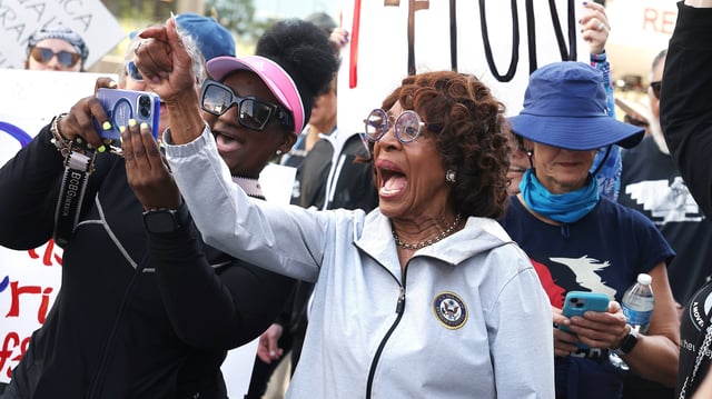 Congresswoman Maxine Waters, center, participates in a march in Westwood, California.