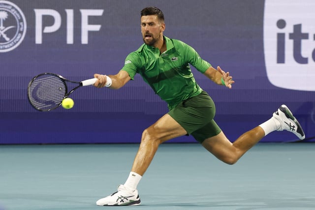 Mar 25, 2025; Miami, FL, USA; Novak Djokovic (SRB) reaches for a forehand against Lorenzo Musetti (ITA)(not pictured) on day eight of the Miami Open at Hard Rock Stadium. Mandatory Credit: Geoff Burke-Imagn Images